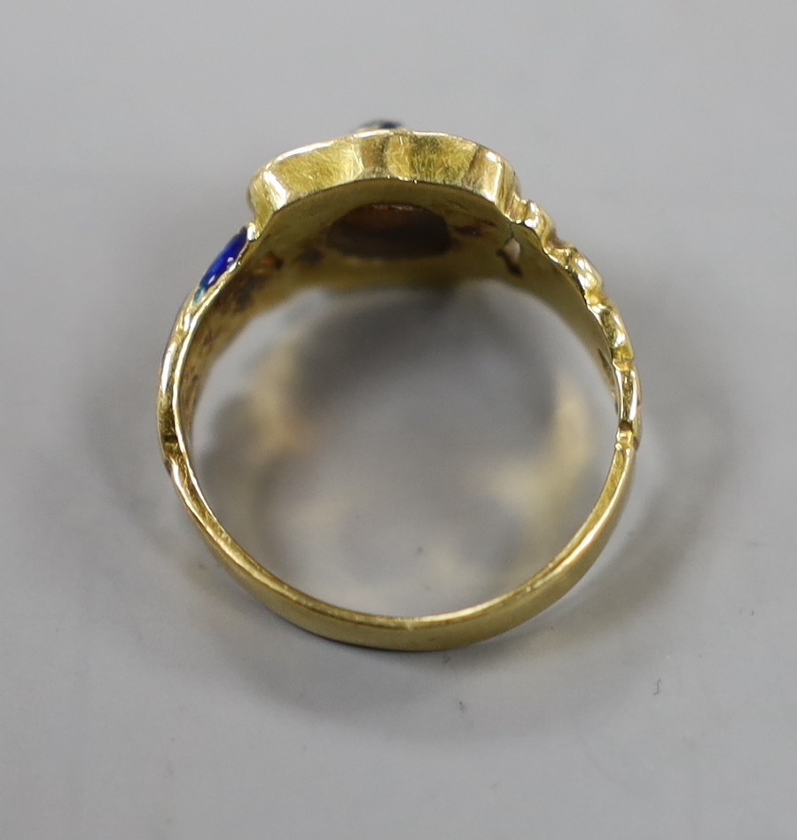 An early 19th century yellow metal (stamped 18), enamel and old cut diamond set ring, size J, gross weight 5.5 grams.